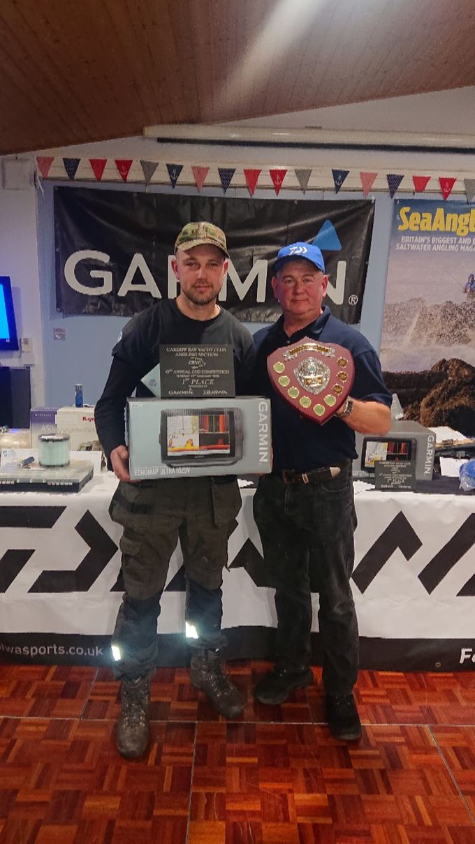 Stewart receiving his prize from cbycs phil Evans. 
